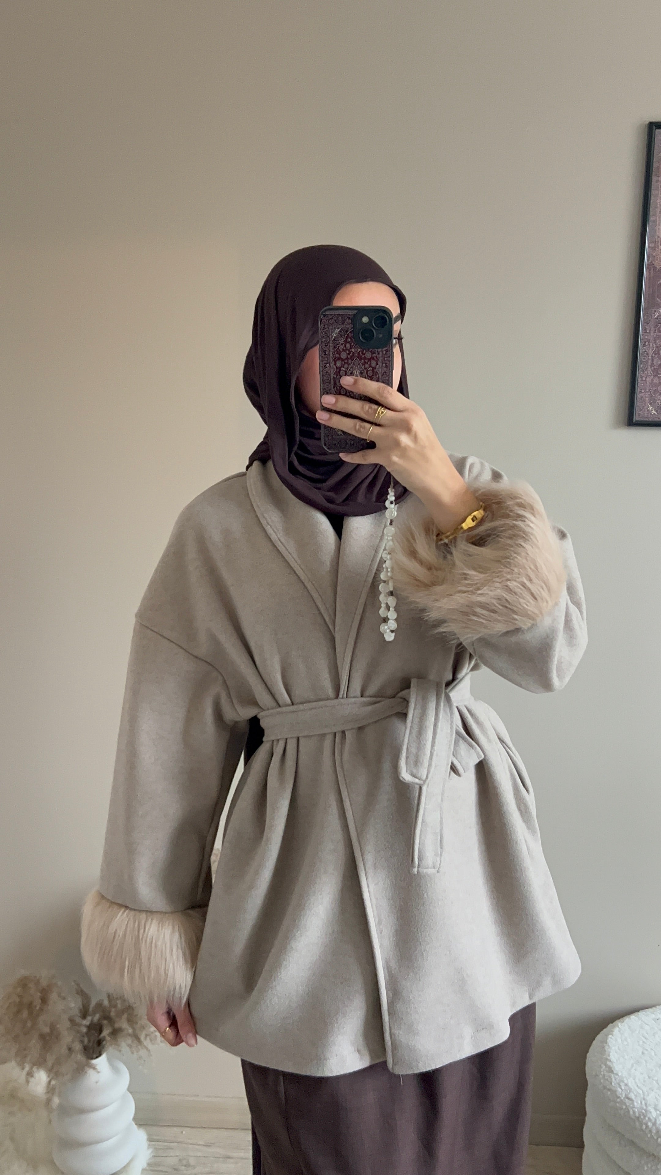 Manteau manche à fourrure